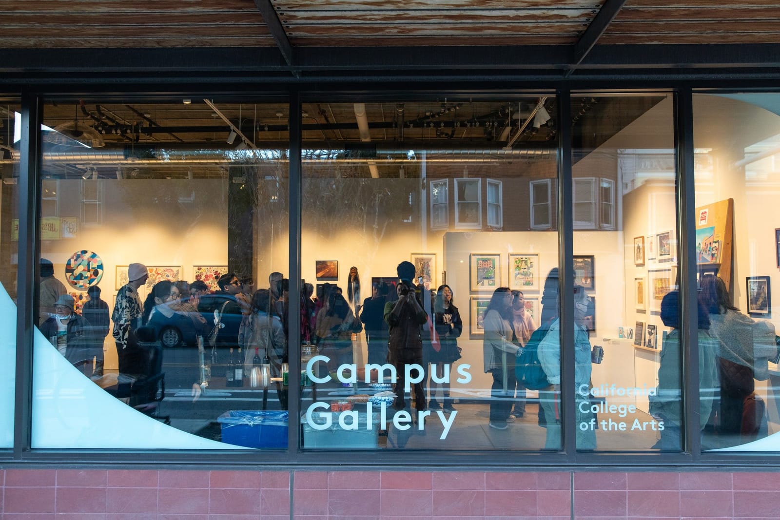 Visitors take in work at the Hello Trouble exhibition in CCA’s Campus Gallery