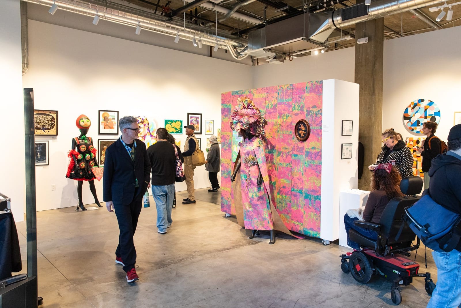 Guests gather in the Campus Gallery during the Hello Trouble exhibition