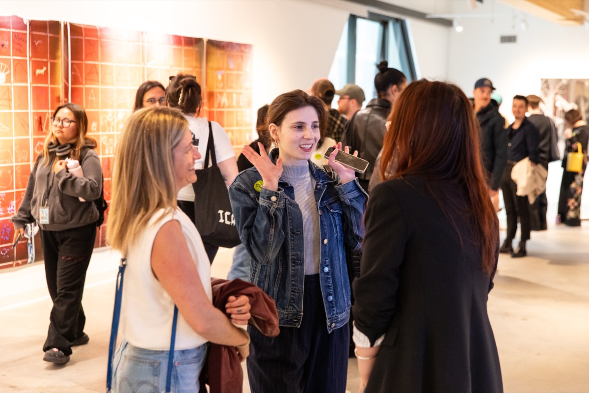 Students and visitors at MFA thesis show opening