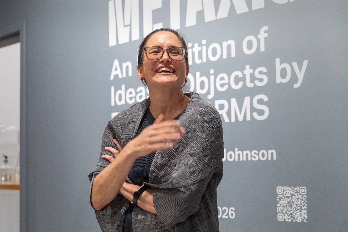 Guests gather at the Metaxis exhibition opening reception